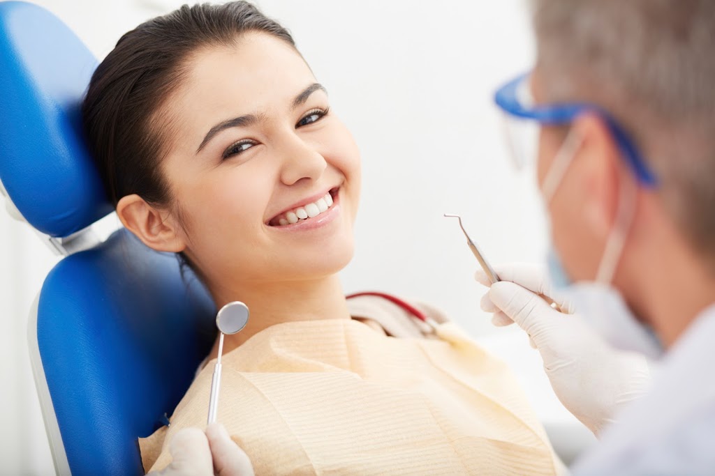 Patient smiling on dental chair