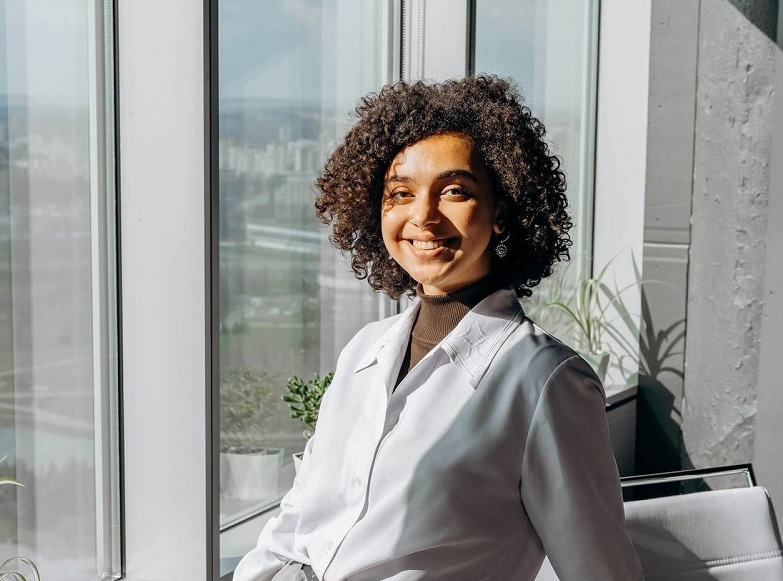 pexels-mikhail-nilov-8297158 (1) (1) girl with curly hair smiling